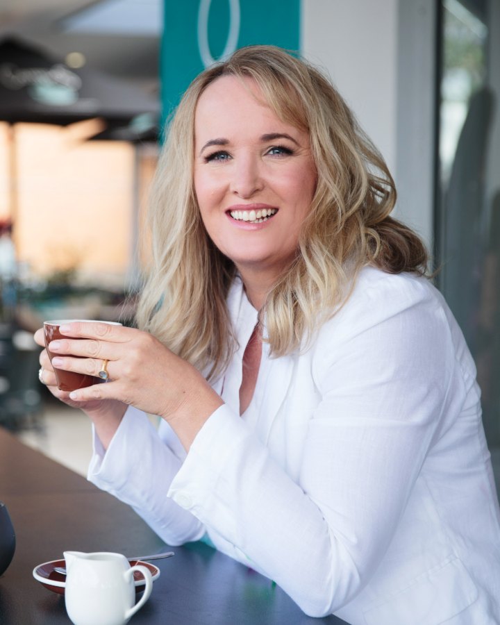 Toni, founder of My Affairs Organized, at a caf&eacute; table